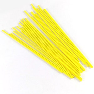 May include: A bundle of bright yellow craft sticks, perfect for arts and crafts projects.