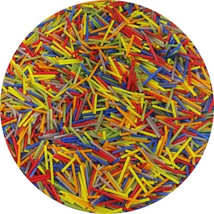 May include: A close-up view of a large assortment of colorful glass rods. The rods are arranged in a circular pattern and are of various lengths and thicknesses. The colors include red, orange, yellow, green, blue, and purple.