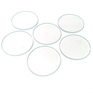 May include: Six clear glass circles, likely for crafts or decorative purposes.