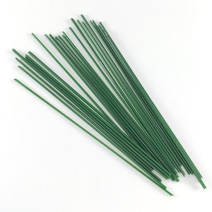 May include: A bundle of green floral wire, used for arranging flowers and crafts.
