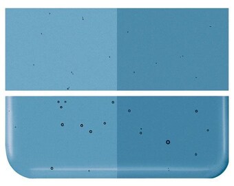 May include: A close-up of two blue glass tiles with a speckled, textured surface. The tiles are separated by a thin white line.