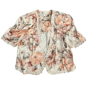 May include: A set of three ceramic mugs with a speckled, matte finish in cream, light grey, and dark grey. Each mug has a simple, minimalist design, suitable for coffee or tea.