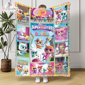 May include: A rectangular fleece blanket featuring the Disney Junior SuperKitties characters in various poses. The center displays the text SuperKitties and the name Brynn. Additional text includes Bitsy Boots Blast Off and Furball Biiiitz.