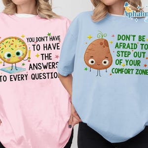 Two people wearing t-shirts with different designs and text.