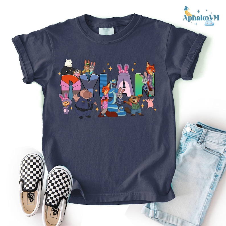 A blue t-shirt with a colorful graphic design featuring cartoon characters, along with a pair of black and white checkered shoes and a pair of blue jeans.