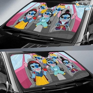 May include: Car sunshade featuring a cartoon design with Stitch characters dressed as Disney princesses. The sunshade has a pink interior and a black exterior, providing protection from the sun's rays. The characters are in a car setting.