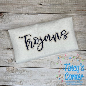 May include: White fabric with the word "Trojans" embroidered in black with a gold outline.