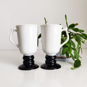 Pair of Black & White Hall coffee cups, irish coffee mugs, footed, pedestal