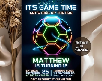 May include: A digital invitation with a black background and a glowing soccer ball design. The text reads "IT'S GAME TIME" and "MATTHEW IS TURNING 12". Includes event details and a Canva logo.