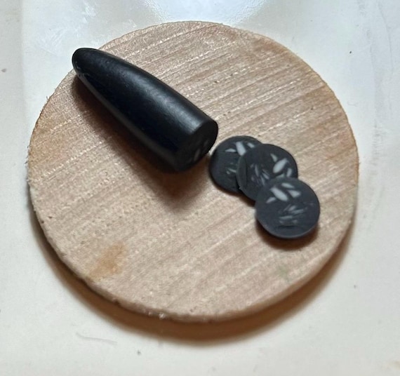 Dollhouse half a cooked black pudding with slices 1/6 scale by Wyrdworldminiatures