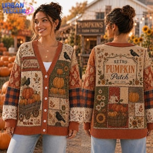 May include: A beige V-neck cardigan featuring a patchwork design with pumpkins, sunflowers, and black birds. The front displays the name Olivia, while the back features the text Retro Pumpkin Patch Est. 1978. The knit garment has a button-down front.