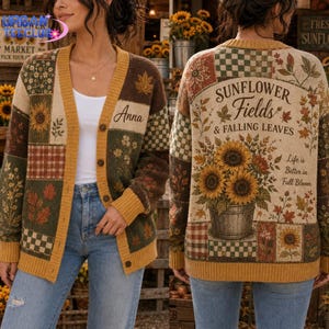 May include: A long-sleeve knit cardigan featuring a patchwork design of sunflowers, autumn leaves, and checkered patterns in shades of brown, green, and yellow. The back displays the text Sunflower Fields & Falling Leaves and Life is Better in Full Bloom, while the front includes the name Anna.