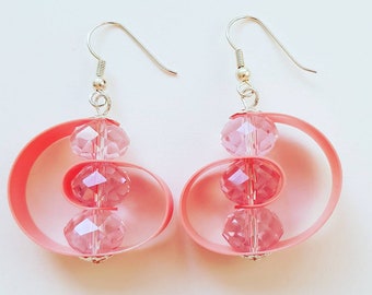 upcycled plastic earrings made of a bodylotion tube with pink glass beads