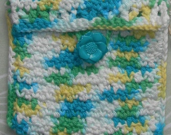 May include: A small crocheted purse with a blue flower button. The purse is made with white, yellow, blue, and green yarn.