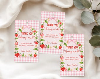 May include: Three pink gingham gift tags with a strawberry theme. Each tag has a pink bow, a strawberry wreath, and the text "THANK YOU berry much" and "Love, Amelia".