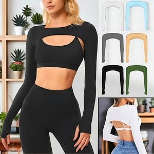 May include: Black long-sleeved crop top with a keyhole cutout, paired with matching leggings and a sports bra. Additional colour options of the crop top are displayed: white, light blue, grey, tan, black, and green. A fitness apparel set.