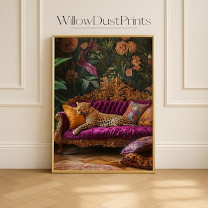 May include: A framed art print depicting a leopard lounging on a purple velvet sofa with patterned cushions. The backdrop features a floral design. The print is labelled "WillowDustPrints" at the top.