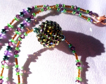 Collar con cuentas púrpura, verde y oro con cristales de bicone y abalorios incrustados de cristal