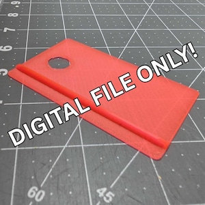 May include: A red rectangular object with a hole and a raised red line. The text "DIGITAL FILE ONLY!" is printed in white across the image. The object is on a gray surface with grid lines.