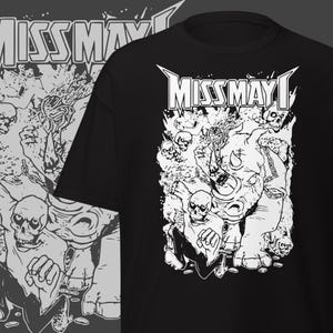 May include: Black t-shirt with a white graphic featuring the text "MISS MAY I" in a stylized font. The graphic includes a rhino, skulls, and other detailed elements, creating a bold, edgy design.