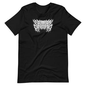 May include: Black t-shirt with a white, stylized graphic design across the chest. The graphic appears to be a band logo or emblem, featuring intricate, dripping, and jagged lines. The shirt is made of a soft material.