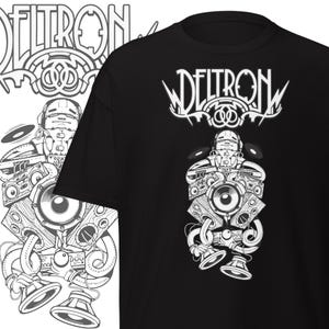 May include: Black t-shirt with a white graphic depicting a robot-like figure made of speakers and audio equipment. The word "DELTRON" is printed above the graphic in a stylized font.