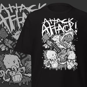 May include: Black t-shirt featuring a cartoon bear-like creature playing a guitar, with the words "ATTACK ATTACK!" in a distressed font. The design is in shades of gray and white, with a grunge aesthetic.