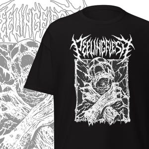 May include: Black t-shirt with a white graphic design. The design features the text "FEELINGFLESH" above a detailed illustration of a screaming figure with skeletal features. The artwork has a distressed, heavy metal aesthetic.