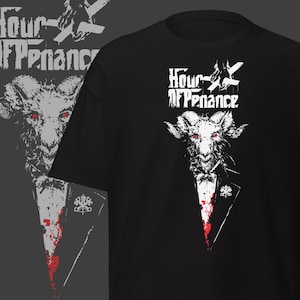 May include: Black t-shirt with a white goat graphic and the text "Hour of Penance". The goat has red eyes and wears a tuxedo with a blood splatter design. The shirt has a crew neck and is made of cotton.