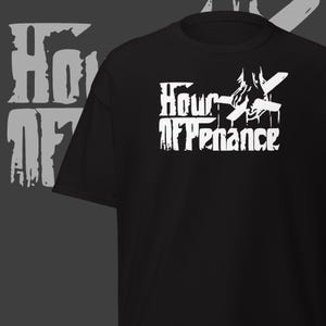 May include: Black t-shirt featuring the white text "Hour After Penance" in a stylized font. The design includes a graphic element above the text. The words "Hour Of" are also visible in a faded, distressed font on the left side.