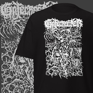 May include: Black t-shirt with a white graphic design. The design features the word "Enterrever" above a detailed, abstract illustration. The illustration has a complex, organic appearance with swirling lines and textures.