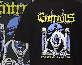 May include: Black t-shirt featuring the word "Entrails" in yellow and white gothic lettering. The graphic depicts a blue-faced, hooded figure with the text "Possessed by Death". The design includes skulls and a castle.