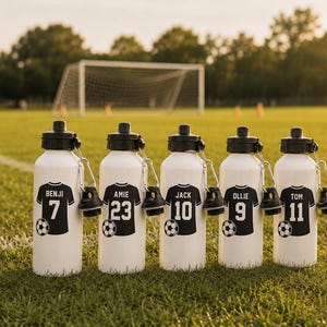 May include: Five white metal water bottles with black screw-top lids and carabiner clips. Each bottle features a black graphic of a football jersey with a name and number: Benji 7, Amie 23, Jack 10, Ollie 9, and Tom 11, each with a football icon.