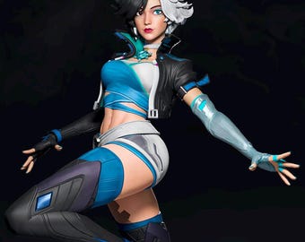 May include: A detailed figurine of a woman with black and white hair, wearing a blue and black outfit. The figure is posed dynamically, with one leg raised and arms outstretched. The base is a blue, crystalline structure.