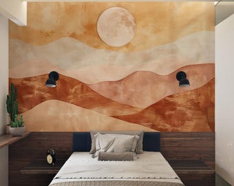 May include: Bedroom interior with a mural depicting a desert landscape in shades of orange, brown, and beige. A large, round moon is affixed to the wall. The bed has a beige comforter and pillows. Two black sconces are mounted on the wall.