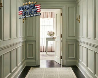 May include: A hallway with light green paneled walls, a dark wood floor, and a patterned rug. The doorway leads to a room with a table and flowers. The text "PEEL and STICK America Owned and Operated" is visible.
