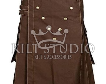 May include: Brown kilt with brass-colored buttons and accents. The kilt features a pleated design and decorative pockets. The text "KILT STUDIO" and "KILT & ACCESSORIES" is printed on the kilt.