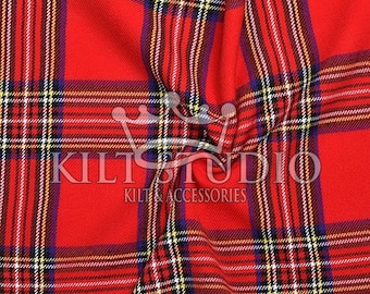 May include: Close-up of a red tartan fabric with a plaid pattern. The design includes black, white, yellow, and blue lines. The text "KILT STUDIO" and "KILTS & ACCESSORIES" is visible.