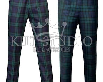 May include: Two pairs of trousers featuring a dark green and navy blue tartan plaid pattern. The pants have a structured waistband with a button closure and belt loops. The text KILT STUDIO KILT & ACCESSORIES is overlaid on the image.