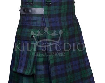May include: A green and blue plaid kilt with black leather straps and buckles. The kilt has a pocket on the front and the text "KILT STUDIO KILTS & ACCESSORIES".