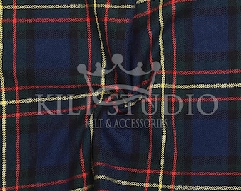 May include: Close-up of a tartan fabric with a repeating pattern of navy blue, green, red, and yellow lines. The text "KILT STUDIO" and "KILT & ACCESSORIES" is visible in white. The fabric has a woven texture.