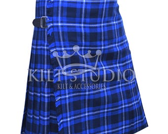 May include: Blue and black plaid kilt with two leather straps and buckles. The kilt has a pleated design and fringe detailing. The text "KILT STUDIO KILT & ACCESSORIES" is visible on the kilt.