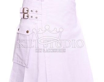 May include: White kilt with pleats, featuring a pocket, buckle closures, and decorative brass-colored rivets. The kilt has the text "Kilt Studio" and "Kilt & Accessories" printed on it. This garment is suitable for various occasions.