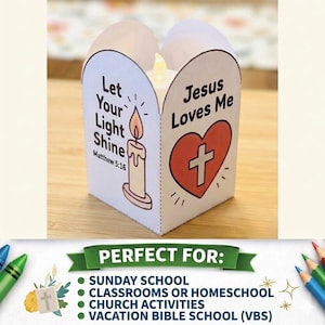 May include: A white paper lantern craft featuring a candle illustration with the text Let Your Light Shine Matthew 5:16 and a red heart graphic containing a white cross with the text Jesus Loves Me, illuminated by a small LED tea light inside.