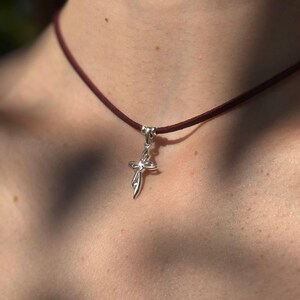 Silver cross leather choker necklace for women, adjustable cord design, perfect minimalist yet elegant jewelry piece