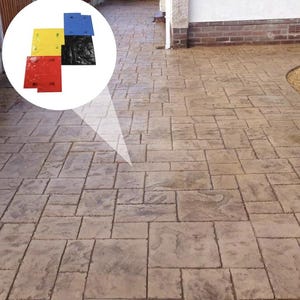 May include: A set of four square concrete stamping mats in red, yellow, blue, and black, featuring a textured surface pattern designed to imprint a stone-like appearance onto wet concrete, shown alongside a finished paved patio area.