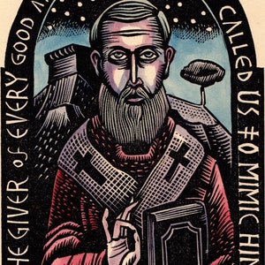 May include: A woodcut illustration of Saint Nicholas of Myra, a bearded man in a red robe with a cross on his chest, holding a book. The image is framed in a black arch with the text "THE GIVER OF EVERY GOOD AND PERFECT GIFT HAS CALLED US TO MIMIC HIM" around the outside.