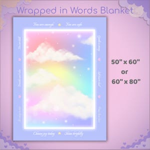 May include: A rectangular blanket with a pastel rainbow design, clouds, and stars. The blanket has a light blue border with text that reads "Wrapped in Words Blanket." The blanket is available in 127cm x 152cm or 152cm x 203cm sizes.