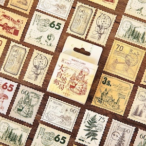 May include: A collection of vintage-style postage stamps with various designs, including trees, buildings, and numbers. A small box of stamps with Japanese text is in the center. The stamps are in shades of brown, green, and red.