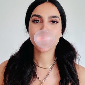 May include: A trio of ceramic mugs with a speckled, matte finish in cream, light grey, and dark grey. Each mug features a simple, minimalist design, ideal for tea or coffee.